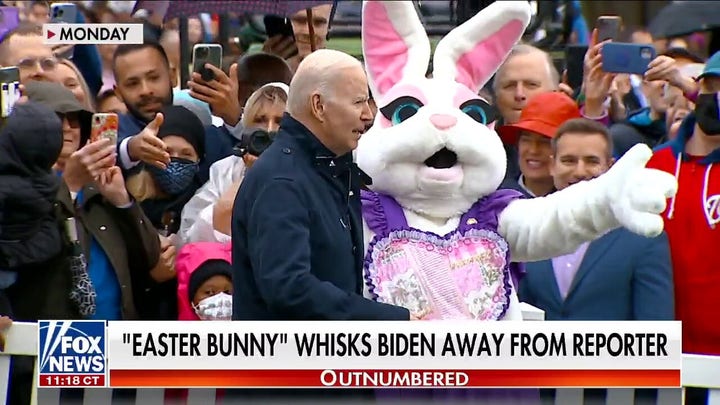 Biden whisked away by 'Easter bunny' while taking reporter questions