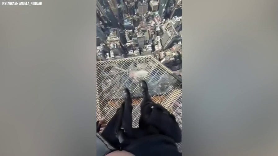Couple posts video from top of Empire State Building during daring climb