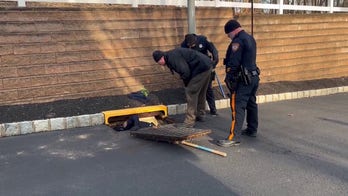 Police investigating NJ councilwoman murder seen removing fabric, sneaker from sewage grates