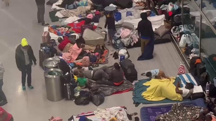 Hundreds of migrants arriving at Boston's Logan Airport