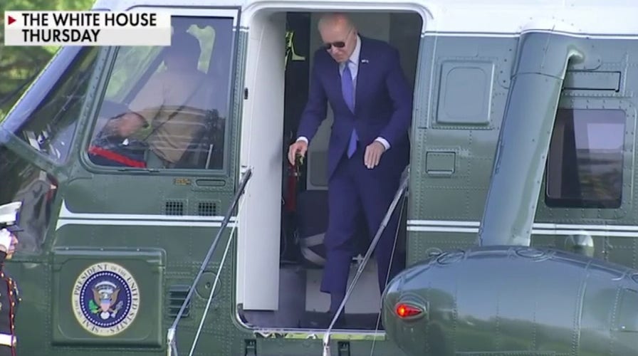 Biden bumps head exiting Marine One after Air Force graduation tumble