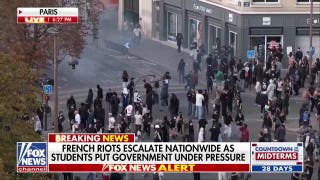 French government faces rising pressure as riots spread