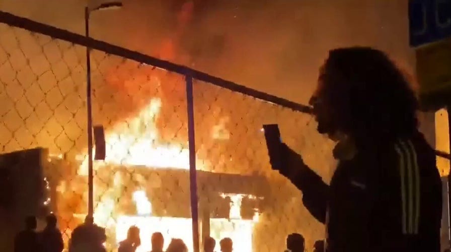 Buildings burn in Minneapolis as rioters ignore curfew order
