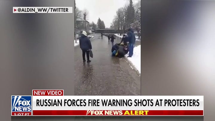 Russian Forces Fire Warning Shots at Protesters