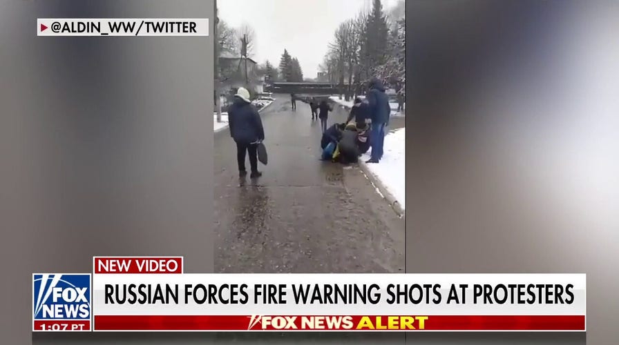Russian Forces Fire Warning Shots at Protesters