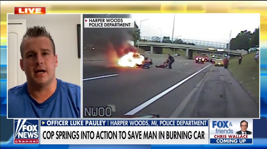  Michigan Police Officer saves man from burning car