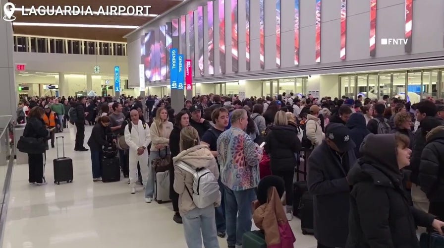 Massive TSA lines astatine  LaGuardia Airport successful  NYC agelong   to parking lot