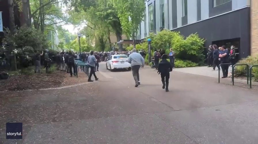 Driver races toward protesters at Portland State University 