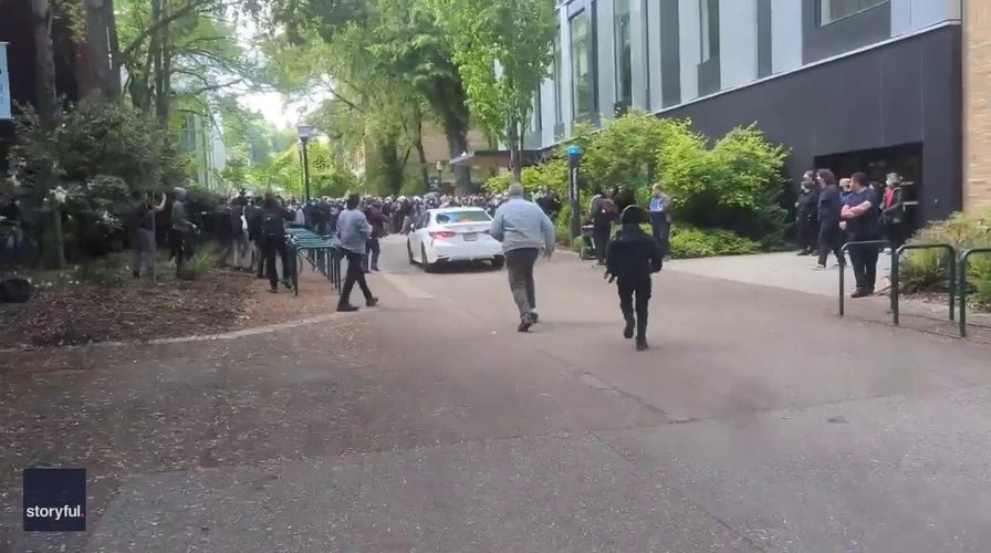 Driver races toward protesters at Portland State University 