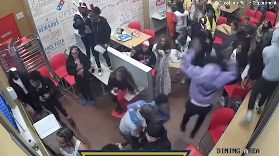 Chaotic overnight fight at Domino’s ends with officer struck by flying chair