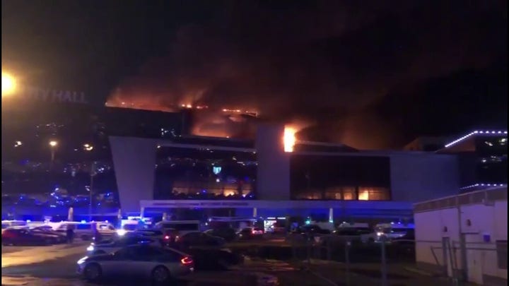 Russia concert hall goes up in flames after attack investigated as terrorism