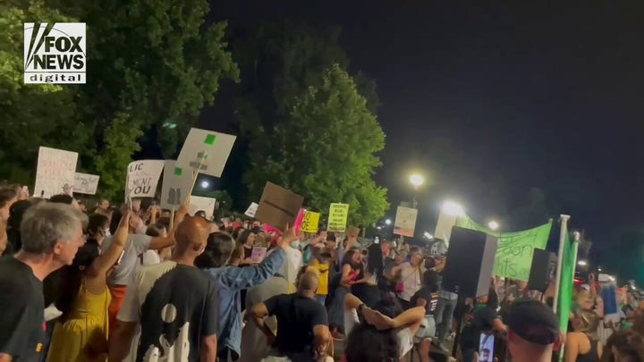 Pro-choice protestors chant "Rise up for abortion rights" outside of the Supreme Court
