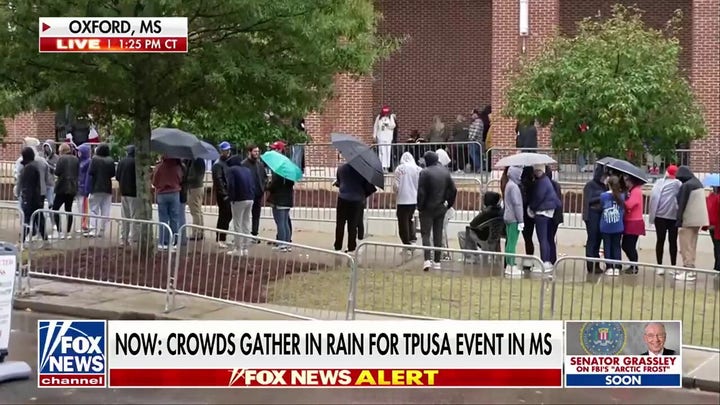 Crowds gather for Turning Point USA event despite rain
