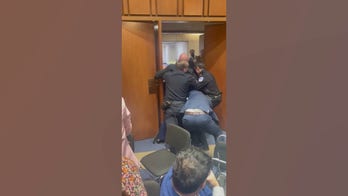 WATCH: Navy SEAL-turned senator tackles 'unhinged' protester during chaotic hearing