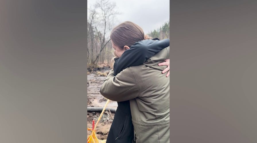 Lithuanian defense minister hugs US ambassador at search site
