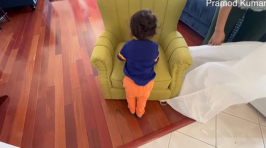 NJ toddler admires the new chair he ordered online from Walmart