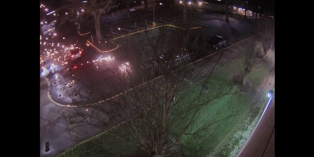 Surveillance video captures ambush of police officer sitting inside patrol car