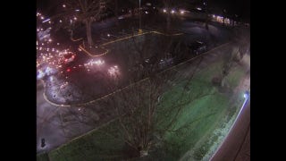 Surveillance video captures ambush of police officer sitting inside patrol car