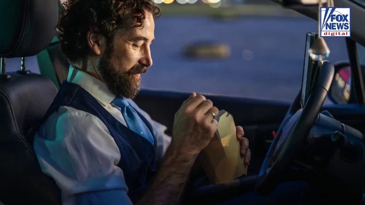 Eating behind the wheel is becoming a lifestyle as busy Americans seek an escape