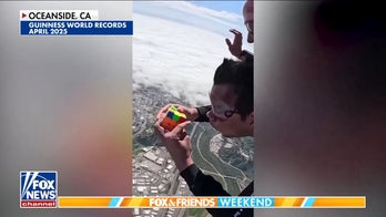 Man breaks world record after solving 2 Rubik's Cubes while skydiving