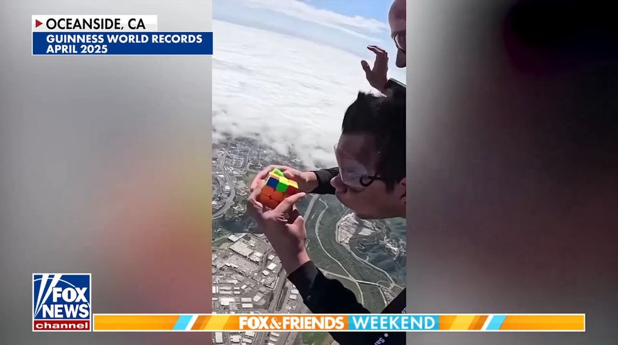 Man breaks world record after solving 2 Rubik's Cubes while skydiving