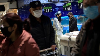 Health experts in China track coronavirus spread	