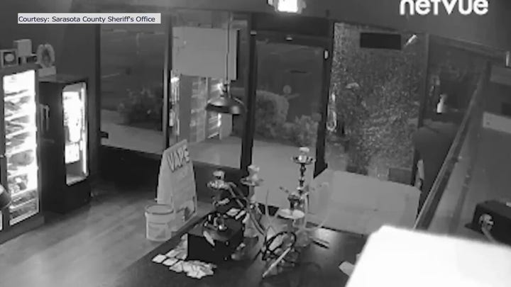 Video shows burglar break into vape shot by shooting out glass