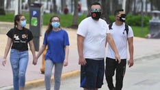 Kansas governor issues executive order requiring masks in public amid coronavirus case surge