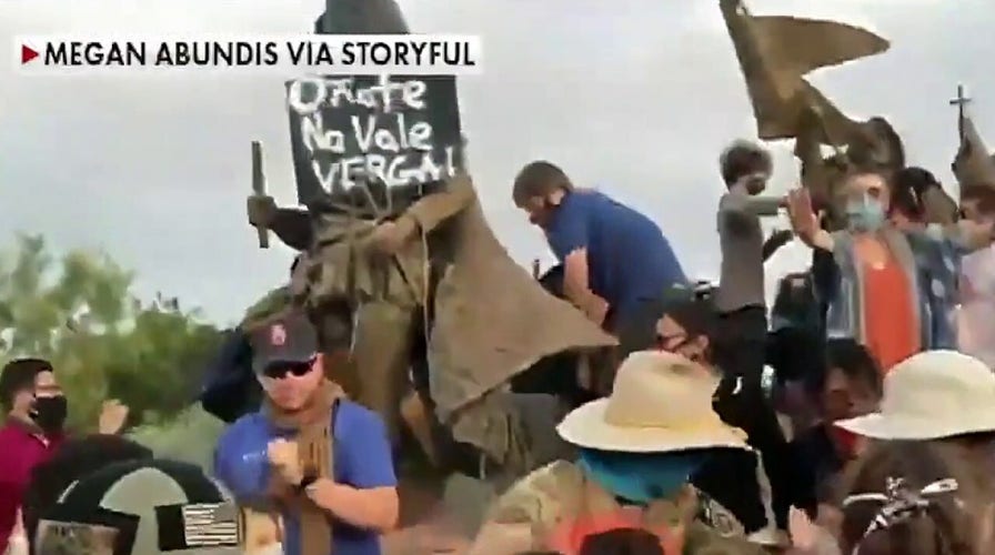 Man shot as New Mexico protesters attempt to topple controversial statue