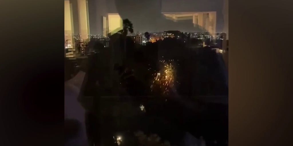 Sparks fly as power lines hit trees amid wildfires