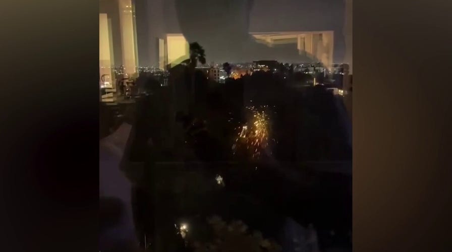 Sparks fly as power lines hit trees amid wildfires