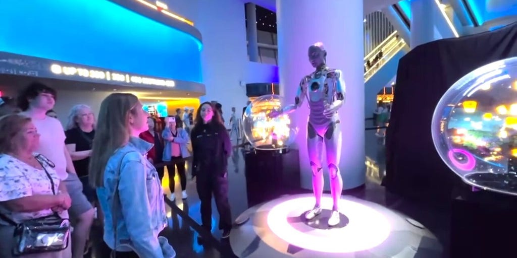 Visitors interact with humanoid robot at the Sphere in Las Vegas