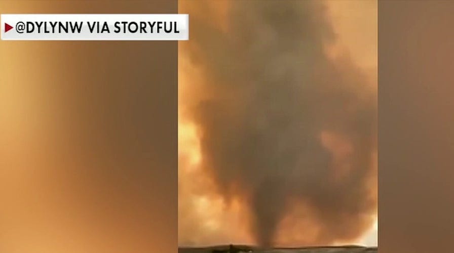 Firenado rips through parts of California, firefighters struggle to remove cars from a highway
