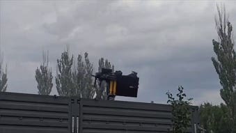 Russian soldier sent flying as Soviet-era helicopter gun spins out of control