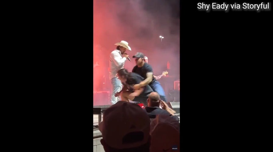 Man tackled by security after rushing towards Gavin Adcock during concert