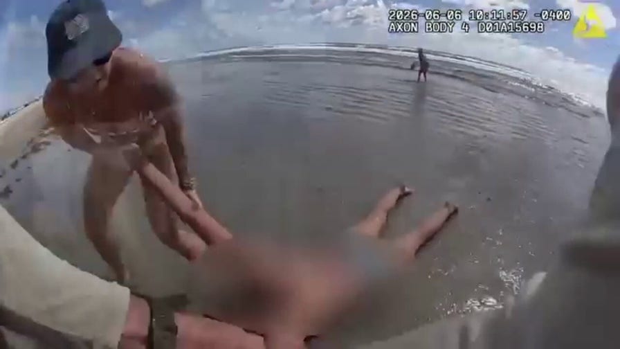 Deputies' dramatic rescue of woman from ocean caught on camera