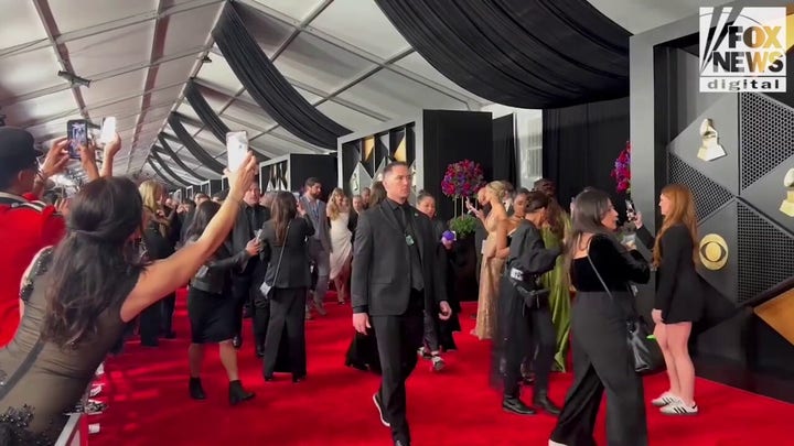 Taylor Swift walks red carpet at Grammys