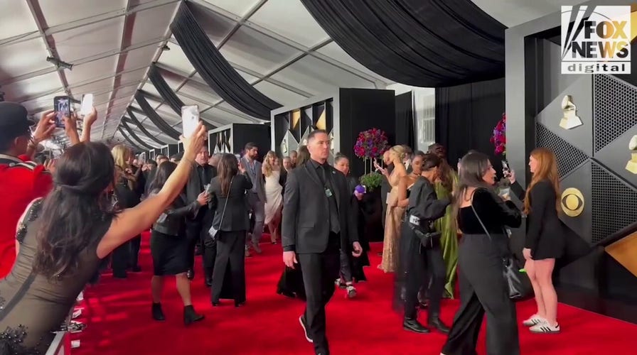 Taylor Swift walks red carpet at Grammys