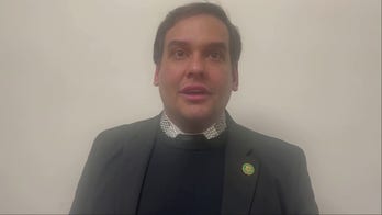 Former Rep. George Santos arrives at the Capitol for Biden's SOTU