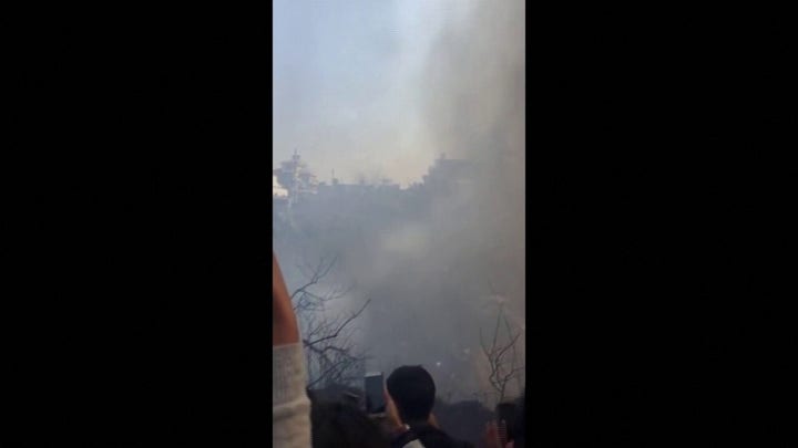 Bystanders film aftermath of Nepal plane crash that killed at least 68