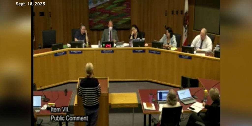 Moms for Liberty Chair Strips at Davis Board Meeting