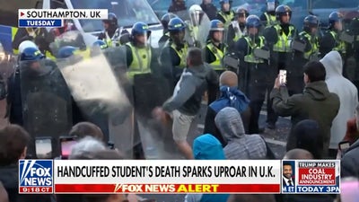 Handcuffed student's death sparks uproar in UK