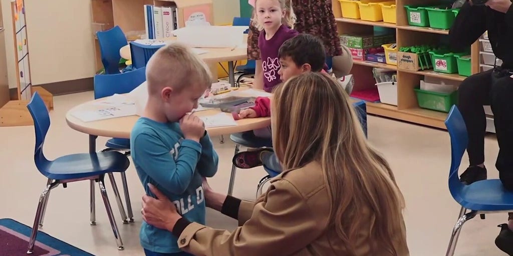 First Lady’s hug with shy student steals the show at Camp Lejeune
