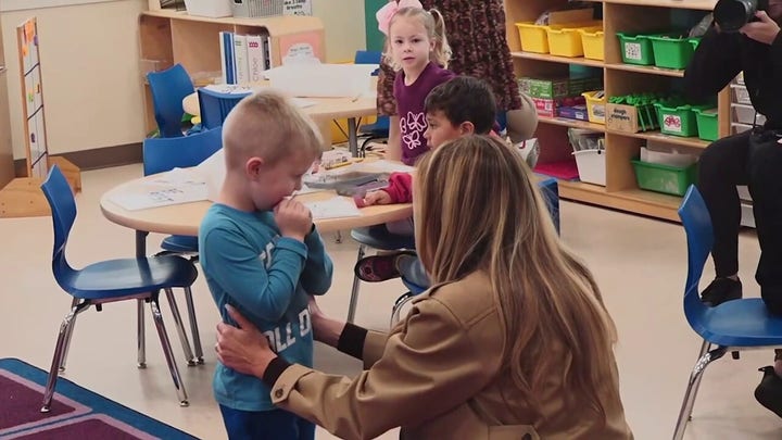 First lady’s hug with shy student steals the show at Camp Lejeune