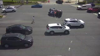Bystanders flip overturned SUV upright on busy Florida boulevard - Fox News