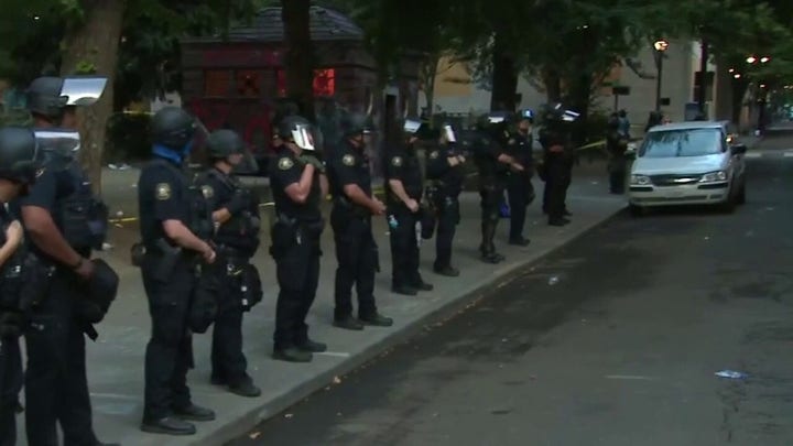 Portland police clear protesters out of park near federal courthouse