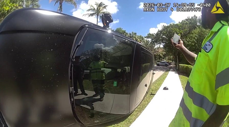Authorities retrieve Tiger Woods' clubs from backmost  windshield aft  crash