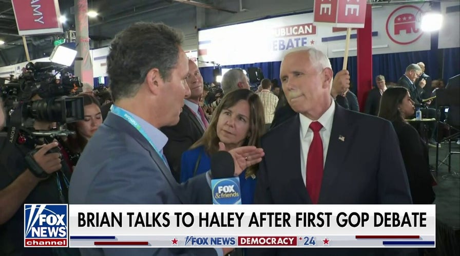 Brian Kilmeade speaks with Republican presidential candidates after the debate