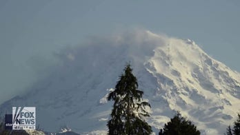 Clouds swirl over Mount Rainier in stunning video