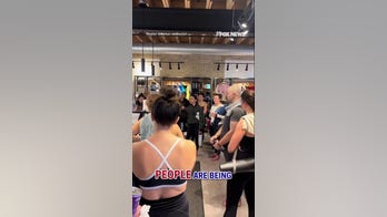 Protesters HECKLE yoga studio for lack of anti-ICE posters